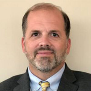 David W. Behrend - Executive Director